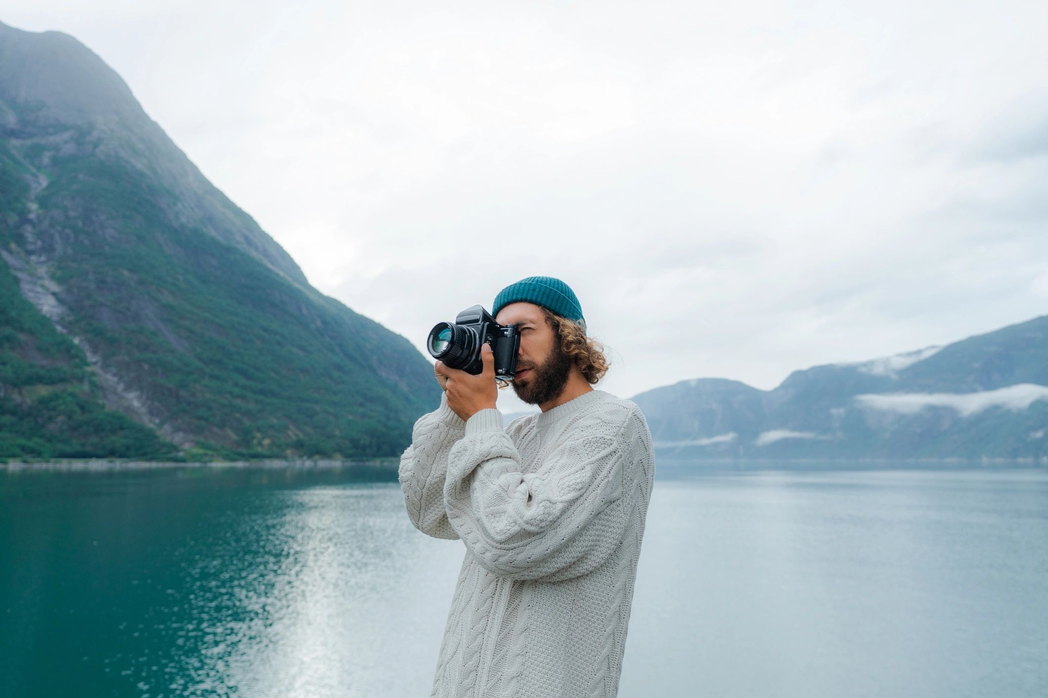 Photographer capturing a scenic landscape