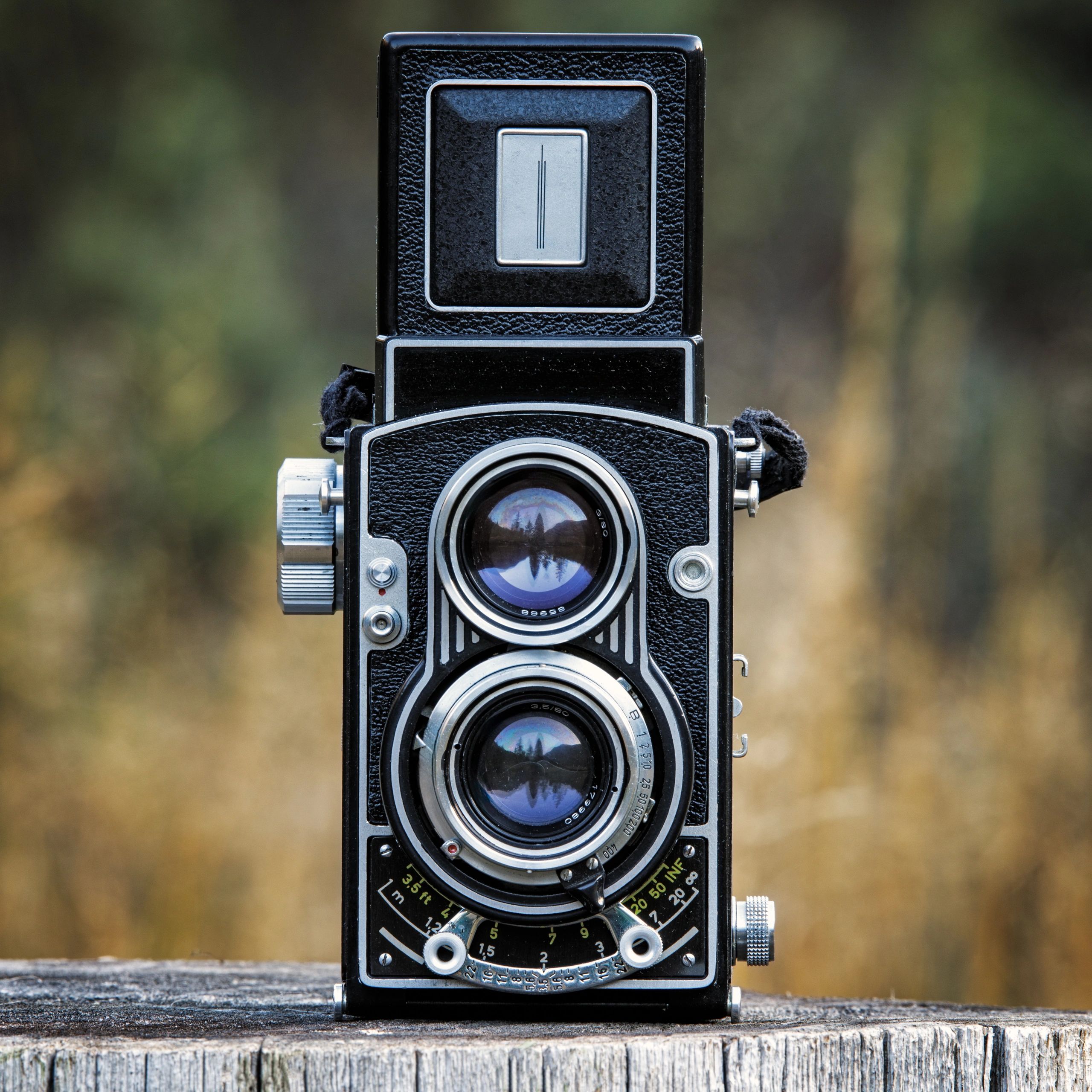 Vintage twin lens reflex camera on wood